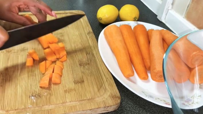chopping carrots into small dice